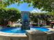 Beautiful tiered fountain in Winter Garden with lush greenery and flowering vines in a landscaped park at 652 Orange Belt Loop, Winter Garden, FL 34787