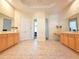 Bright bathroom boasting double sinks, vanity, and tile flooring at 9137 Southern Breeze Dr, Orlando, FL 32836