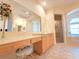 Luxurious bathroom with large vanity, countertop space, shower, and natural light at 9137 Southern Breeze Dr, Orlando, FL 32836