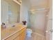 Bright bathroom featuring a glass-enclosed shower, light colored walls, and vanity at 9137 Southern Breeze Dr, Orlando, FL 32836