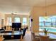 Bright breakfast nook overlooking the pool and canal is situated between the kitchen and the living room at 9137 Southern Breeze Dr, Orlando, FL 32836