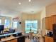 Breakfast nook with banquette seating overlooks the pool and waterway, adjacent to the kitchen and living room at 9137 Southern Breeze Dr, Orlando, FL 32836