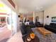 Open living room with access to the patio, and views into the kitchen at 9137 Southern Breeze Dr, Orlando, FL 32836