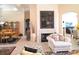 Open-concept living room with fireplace and views into dining and sitting areas at 9137 Southern Breeze Dr, Orlando, FL 32836