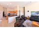 Open-concept living room with views to the kitchen and staircase at 9137 Southern Breeze Dr, Orlando, FL 32836