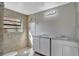 Bathroom featuring double sinks, a walk in shower, and tiled floors at 975 Cross Cut Way, Longwood, FL 32750