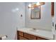 Half bathroom featuring a sink with vanity and mirror at 975 Cross Cut Way, Longwood, FL 32750