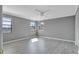 Neutral bedroom featuring a ceiling fan, neutral walls, and hardwood floors at 975 Cross Cut Way, Longwood, FL 32750