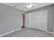 Bright bedroom featuring a ceiling fan, neutral walls, and an ample closet at 975 Cross Cut Way, Longwood, FL 32750