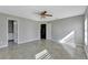 Bedroom featuring tile floors, ceiling fan and an adjoining bathroom at 975 Cross Cut Way, Longwood, FL 32750