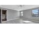 Neutral bedroom featuring a ceiling fan, neutral walls, and hardwood floors at 975 Cross Cut Way, Longwood, FL 32750