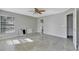 Bedroom featuring tile floors, ceiling fan and three windows at 975 Cross Cut Way, Longwood, FL 32750