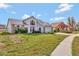 Charming two-story home featuring neutral siding, brick accents and a well-manicured lawn at 975 Cross Cut Way, Longwood, FL 32750