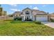 Charming two-story home featuring neutral siding, brick accents and a well-manicured lawn at 975 Cross Cut Way, Longwood, FL 32750