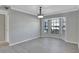 Bright, airy living room featuring large bay window and stylish hanging light fixture at 975 Cross Cut Way, Longwood, FL 32750