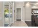 Bright entryway with tile flooring leading to the pool with french doors and a glimpse into an adjacent living space at 9783 Covent Garden Dr, Orlando, FL 32827