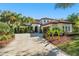 Charming home featuring a tile roof, a concrete driveway, and well-maintained landscaping at 9783 Covent Garden Dr, Orlando, FL 32827