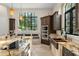 Kitchen island featuring granite counters, stainless steel appliances, and breakfast bar at 9783 Covent Garden Dr, Orlando, FL 32827