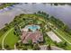 Aerial view of the amenity center featuring a pool, beach volleyball court, and mini golf at 10303 Atwater Bay Dr, Winter Garden, FL 34787