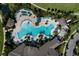 Aerial view of a community pool with plenty of lounge chairs and umbrellas at 10303 Atwater Bay Dr, Winter Garden, FL 34787