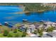 Aerial view of a charming home with a boat dock on a serene lake at 10303 Atwater Bay Dr, Winter Garden, FL 34787