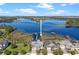 Aerial view showcases the home's location on a picturesque lake with private docks at 10303 Atwater Bay Dr, Winter Garden, FL 34787