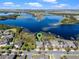 An aerial view of a home with a lush lake at 10303 Atwater Bay Dr, Winter Garden, FL 34787