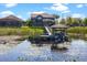 Backyard with dock, providing direct access to the lake, perfect for water activities at 10303 Atwater Bay Dr, Winter Garden, FL 34787