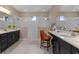 Bathroom with a large double shower, dual vanities, dark cabinets, and a make-up vanity at 10303 Atwater Bay Dr, Winter Garden, FL 34787