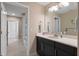 Modern bathroom with dual sinks and open doorway at 10303 Atwater Bay Dr, Winter Garden, FL 34787