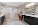 Spacious bathroom offering dual sinks, generous vanity space, and an accessible walk-in shower for comfort at 10303 Atwater Bay Dr, Winter Garden, FL 34787