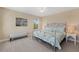 Cozy bedroom featuring a metal-framed bed, a ceiling fan, and serene decor at 10303 Atwater Bay Dr, Winter Garden, FL 34787
