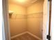 Walk-in closet with carpeted floor and metal shelving for optimal storage capacity at 10303 Atwater Bay Dr, Winter Garden, FL 34787