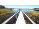 View down the dock, with gazebos, onto the calm lake at 10303 Atwater Bay Dr, Winter Garden, FL 34787