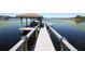 The dock leads to a gazebo with a boat and a lake view at 10303 Atwater Bay Dr, Winter Garden, FL 34787
