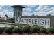 Waterleigh community entrance sign with manicured landscaping and water feature at 10303 Atwater Bay Dr, Winter Garden, FL 34787