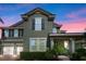 Charming two-story home with a well-manicured lawn and inviting entrance at 10303 Atwater Bay Dr, Winter Garden, FL 34787