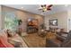 Cozy living room with stylish furnishings, natural lighting, and a textured accent wall at 10303 Atwater Bay Dr, Winter Garden, FL 34787