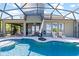 Back patio of this Florida home, featuring a refreshing pool, seating, and screened enclosure for outdoor enjoyment at 10303 Atwater Bay Dr, Winter Garden, FL 34787