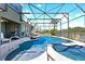 Relaxing screened pool and spa with lake views, seamlessly blending indoor and outdoor living at 10303 Atwater Bay Dr, Winter Garden, FL 34787