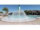 Community splash pad area with fountains, palm trees, and covered seating at 10303 Atwater Bay Dr, Winter Garden, FL 34787