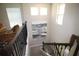 Carpeted staircase with dark, decorative wrought iron banister and windows providing natural light at 10303 Atwater Bay Dr, Winter Garden, FL 34787