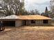 Image of a house under construction, highlighting the block structure, roof installation and a two-car garage at 13010 Hazelnut Ln, Astatula, FL 34705