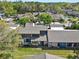 Aerial view of the property featuring lush trees and landscaping surrounding a condo community at 1105 Woodbine St, Fern Park, FL 32730