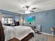 Calm and spacious bedroom featuring a ceiling fan, a TV and cozy furniture at 1105 Woodbine St, Fern Park, FL 32730