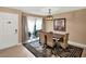 Bright dining room features elegant lighting, tile flooring, and sliding glass door at 1105 Woodbine St, Fern Park, FL 32730