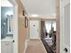 Inviting hallway that leads to a bathroom, front door and living area filled with natural light at 1105 Woodbine St, Fern Park, FL 32730