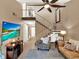 Cozy living room features a ceiling fan, staircase, and entertainment area at 1105 Woodbine St, Fern Park, FL 32730