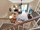 Comfortable living area viewed from above features cozy seating, a ceiling fan, and large windows at 1105 Woodbine St, Fern Park, FL 32730