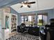 Functional home office featuring built-in bookshelves and bright natural light at 1105 Woodbine St, Fern Park, FL 32730